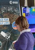 A delegate browsing the ESA stand 